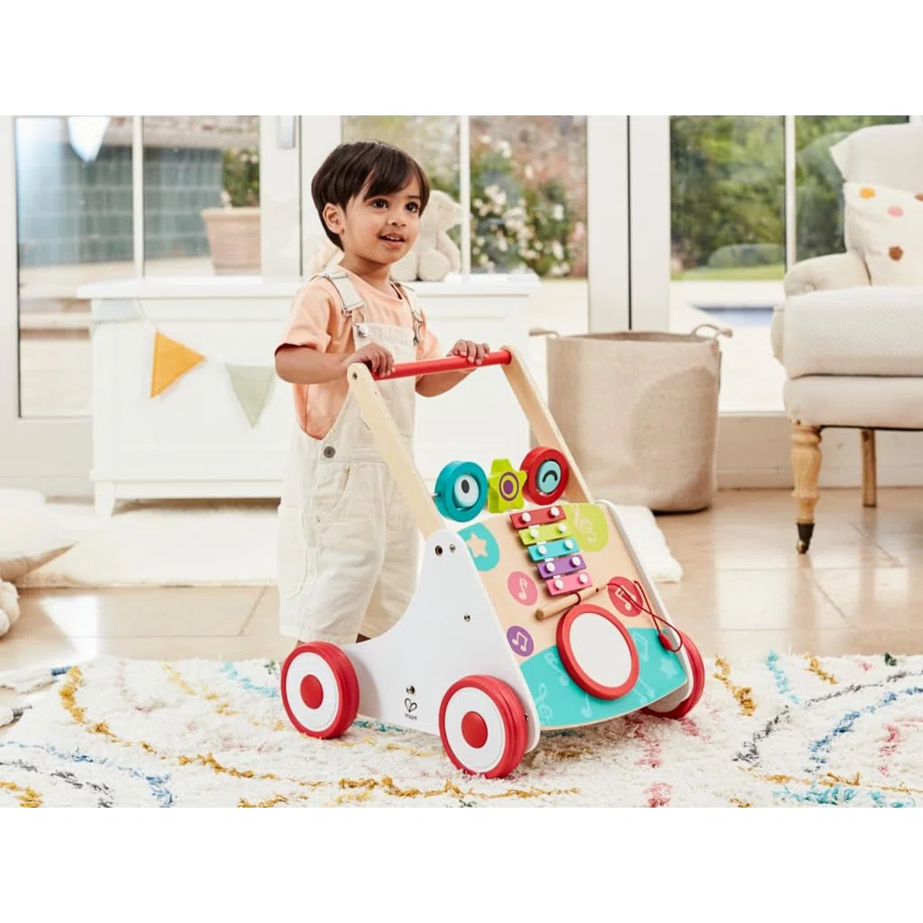 Hape Musik Lauflernwagen - Lauflernhilfe aus Holz mit Musik Xylofon, Trommel & drehbaren Blöcken, fördert Motorik, Balance und musikalische Früherziehung, ab 10 Monaten