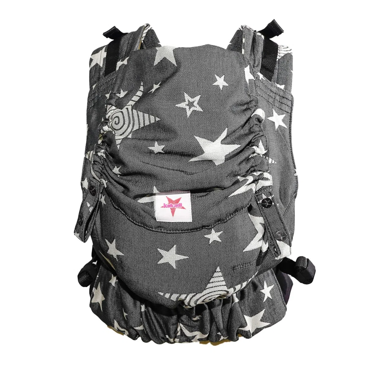 KOKADI Flip X Diorite Stars (Unisize)-Perfekte Kombi aus Fullbuckle & dem Tragen überkreuzt -Ab Geburt - 15 kg,handgefertigt aus 100%Bio-Baumwolle –Ergonomische Babybauchtrage Rückentrage Tragetasche